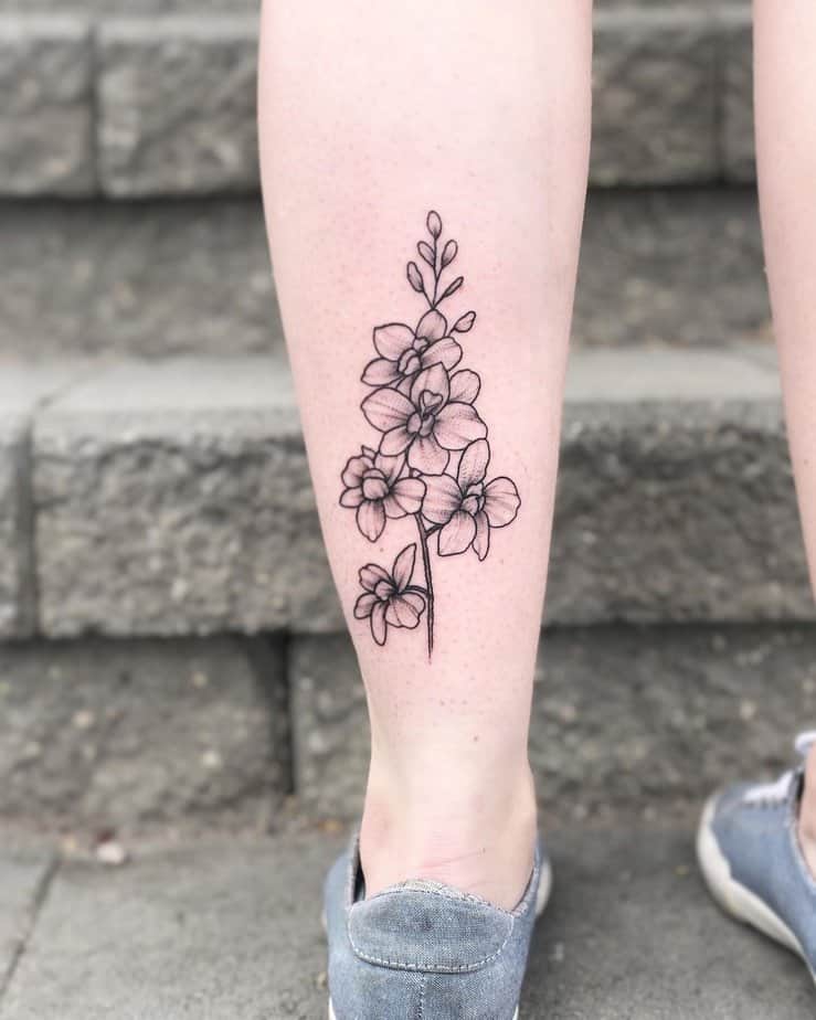 10. Linework larkspur calf tattoo