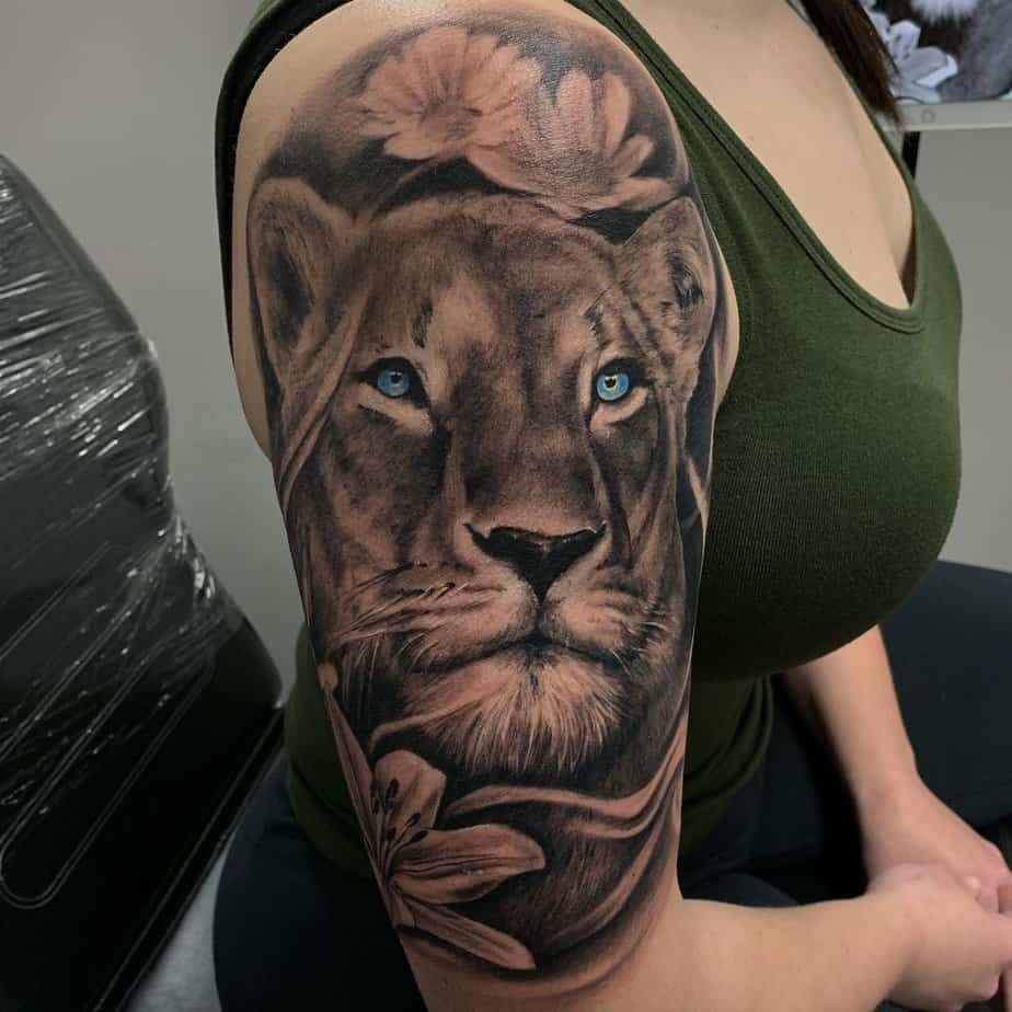 10. Realistic lioness with piercing blue eyes