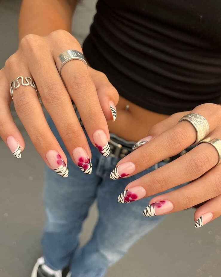 10. Subtle zebra French tips with floral accents