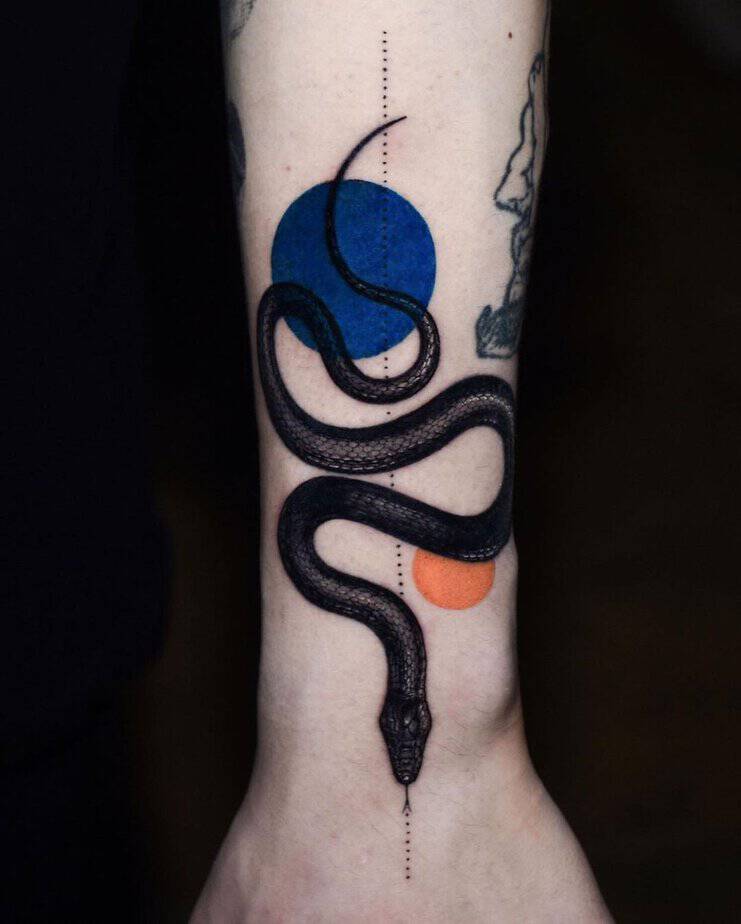 12. Black mamba with geometric shapes tattoo