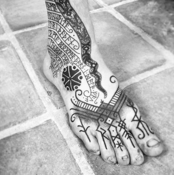 14. Awesome foot rune tattoo