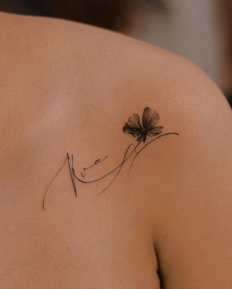 14. Elegant clover and signature tattoo