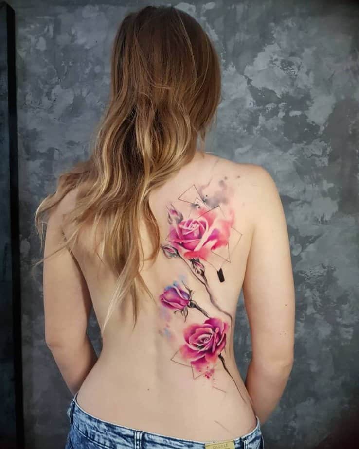 18. A vibrant pink rose tattoo covering the back