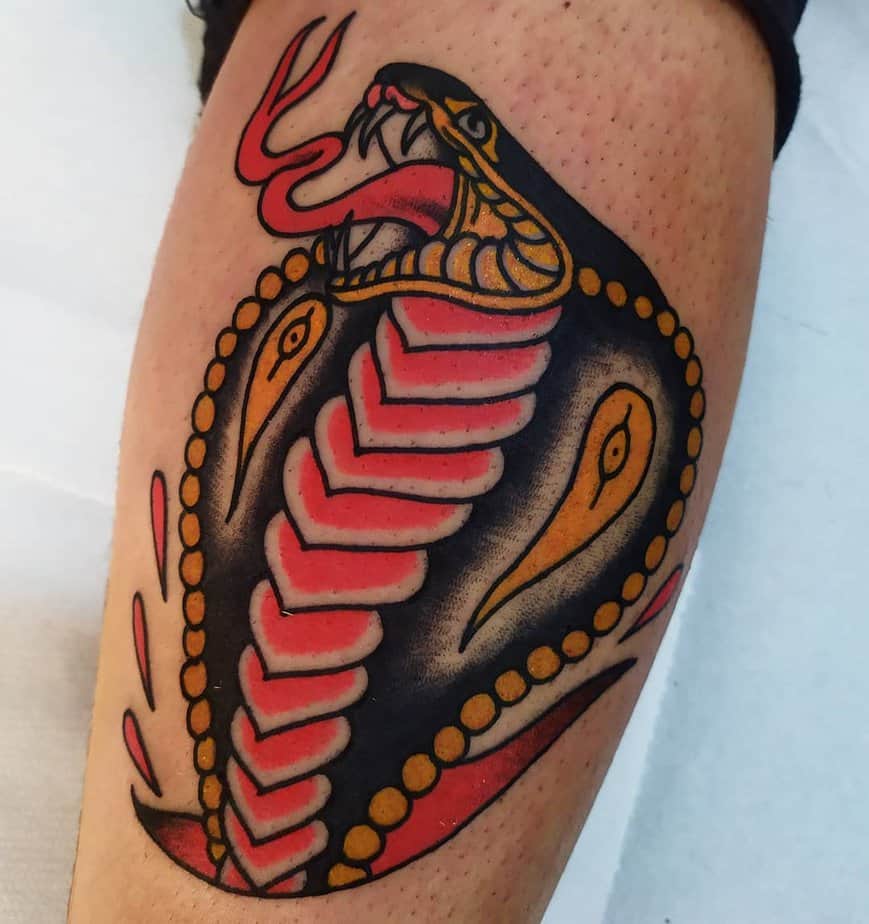 18. Classic black mamba flash tattoo