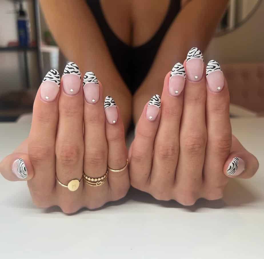 18. Zebra French tips with rhinestones