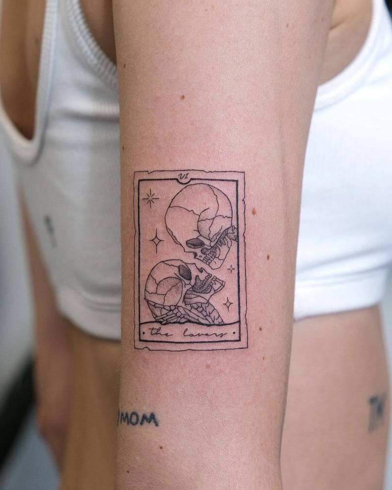 2. The lovers tarot tattoo with skulls