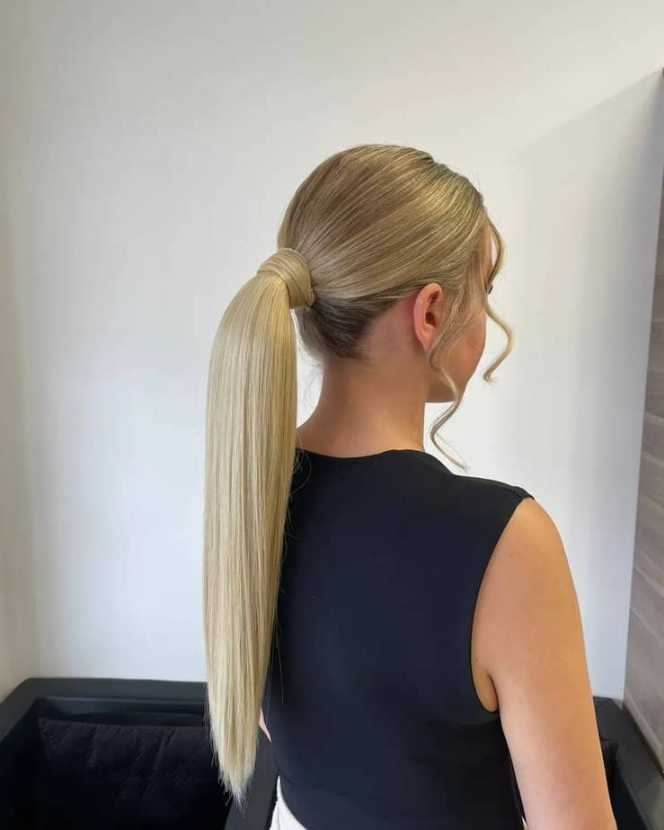 20. Classic low ponytail with sleek waves