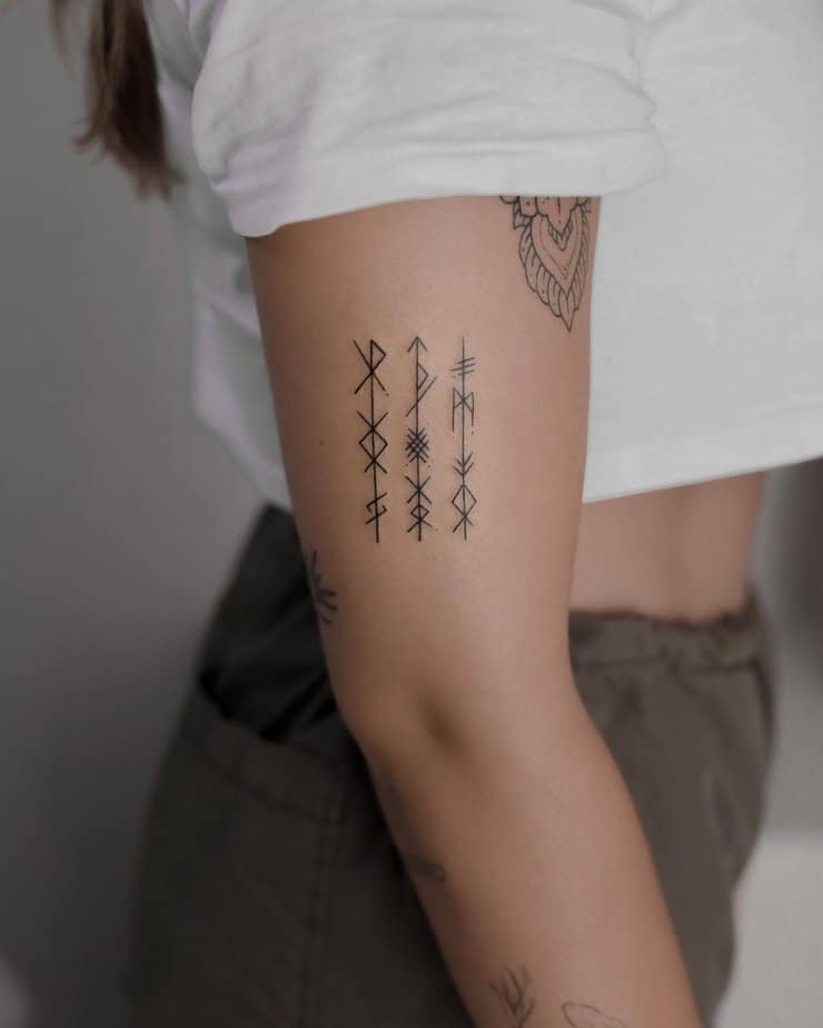 20. Delicate rune rows on the arm