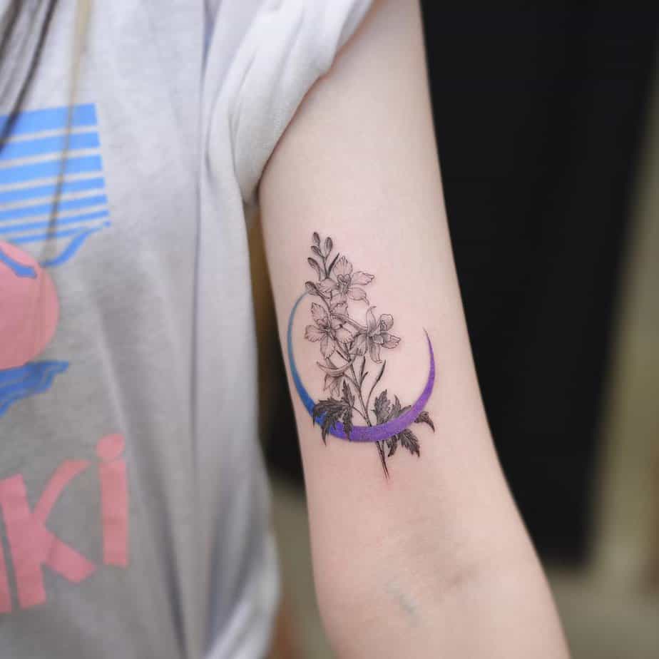 20. Larkspur with a crescent moon tattoo