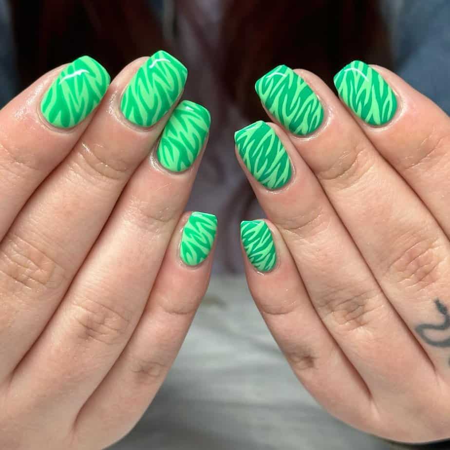 34. Neon green zebra nails