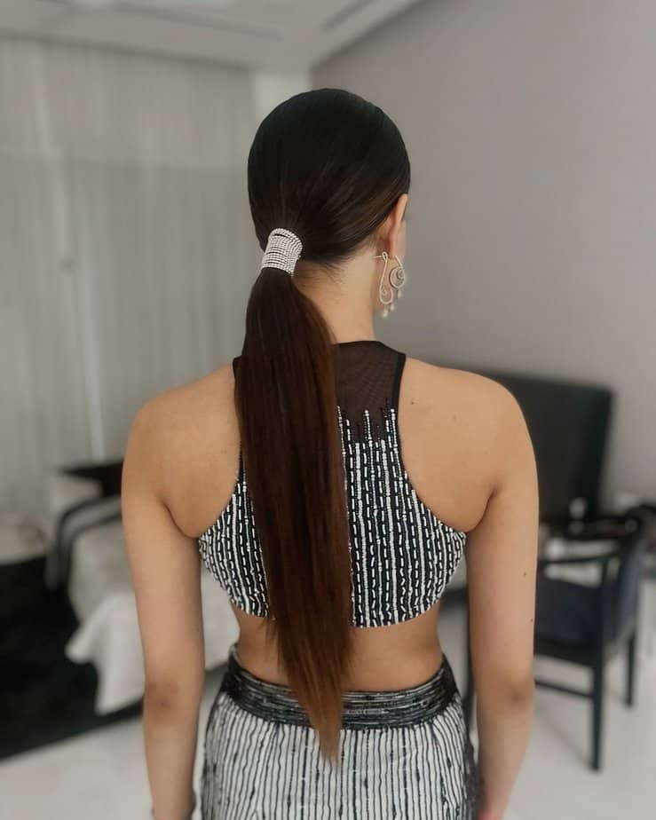 36. Sleek ponytail with rhinestone glam