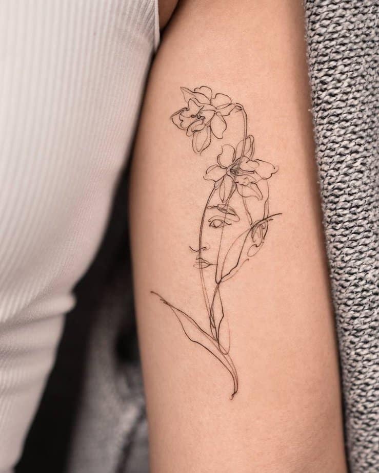 4. March birth flower tattoo with a face