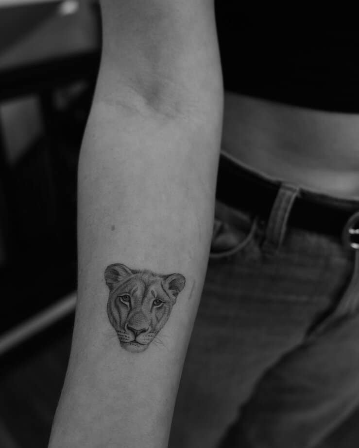 4. Tiny lioness face on forearm