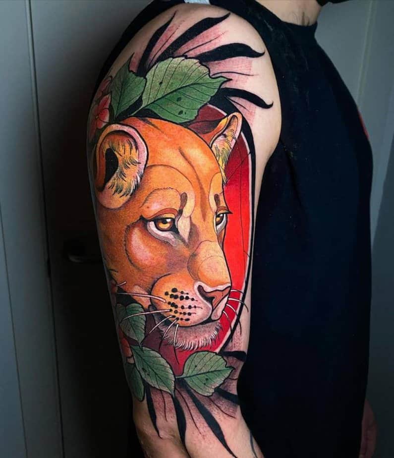 5. Colorful lioness on the upper arm