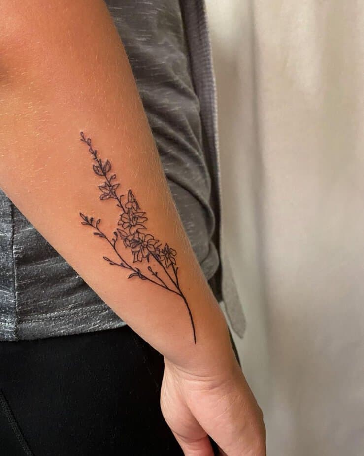 6. Minimalist larkspur branch on the arm