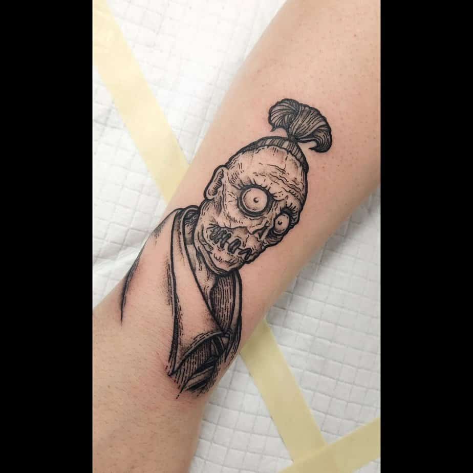 6. Shrunken head ghost tattoo