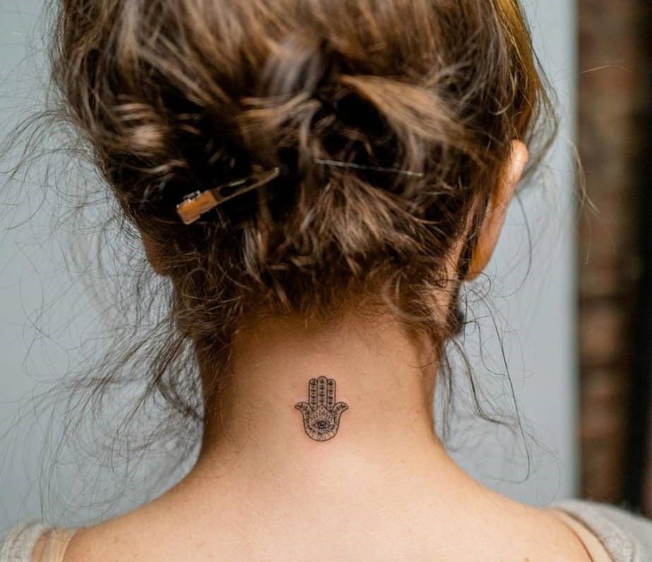 8. Hamsa tattoo on the nape of the neck