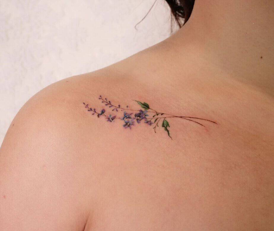 8. Subtle larkspur shoulder tattoo