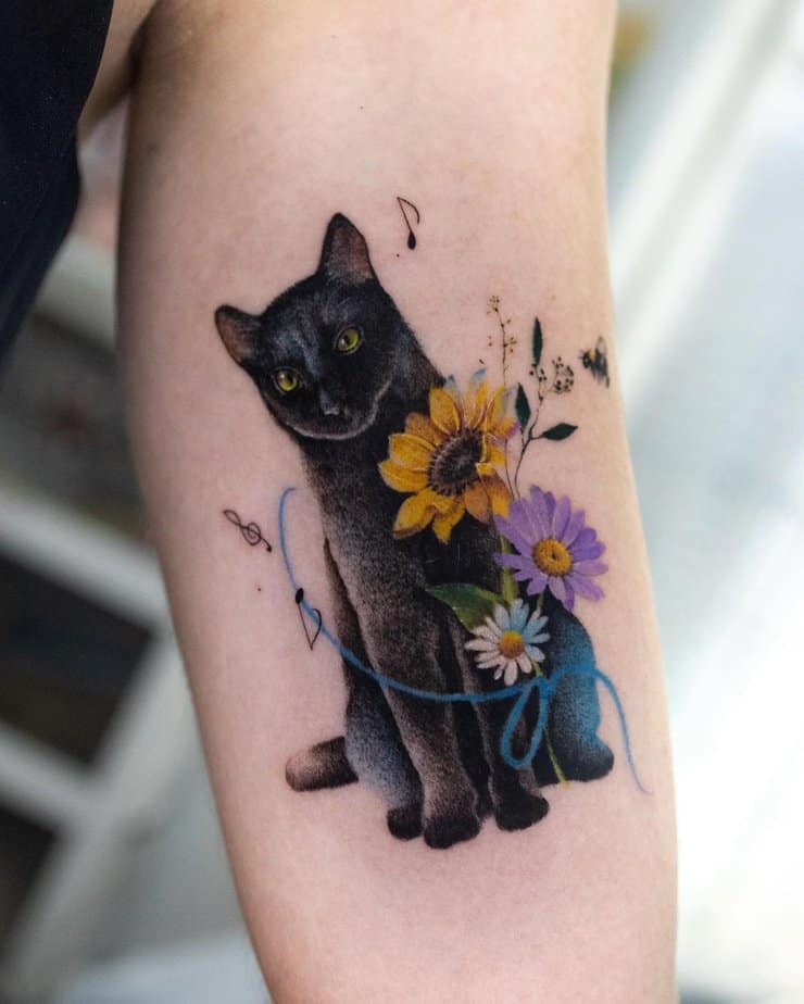 Black cat with flowers