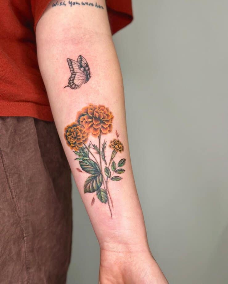 Butterfly and marigold tattoo