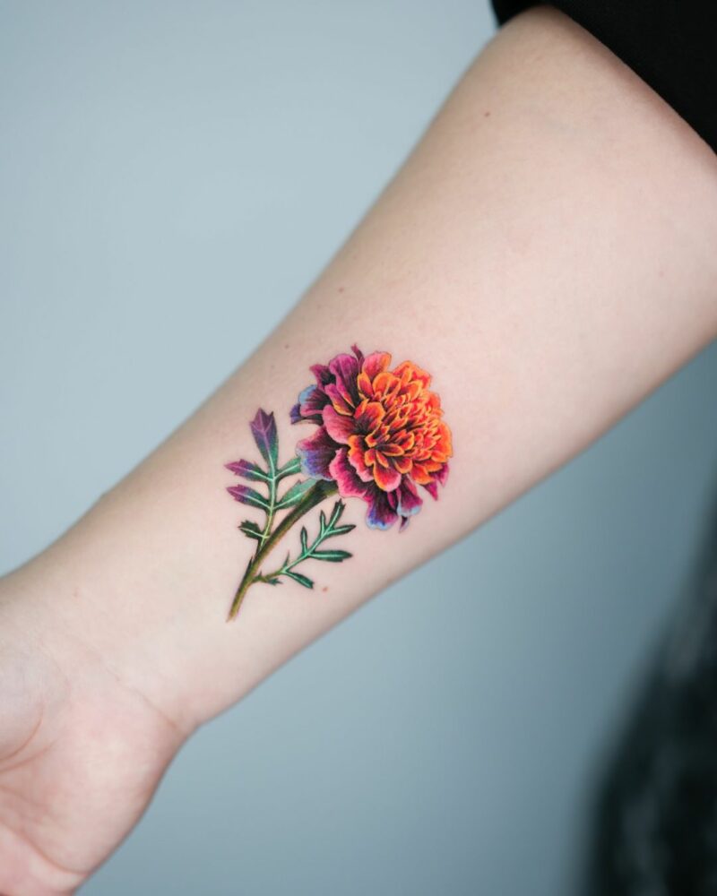 Colorful marigold tattoo