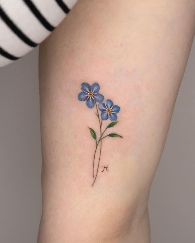 Forget me not flower tattoo with an initial