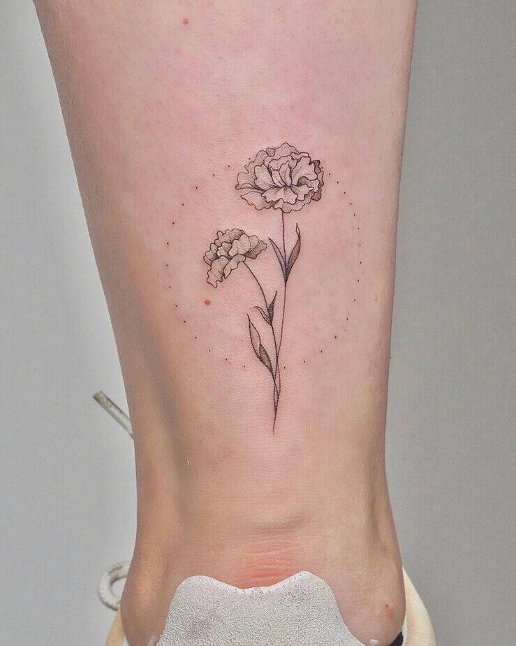 Geometric marigold tattoo