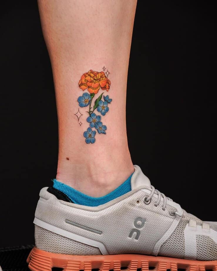 Marigold and forget me not flower tattoo