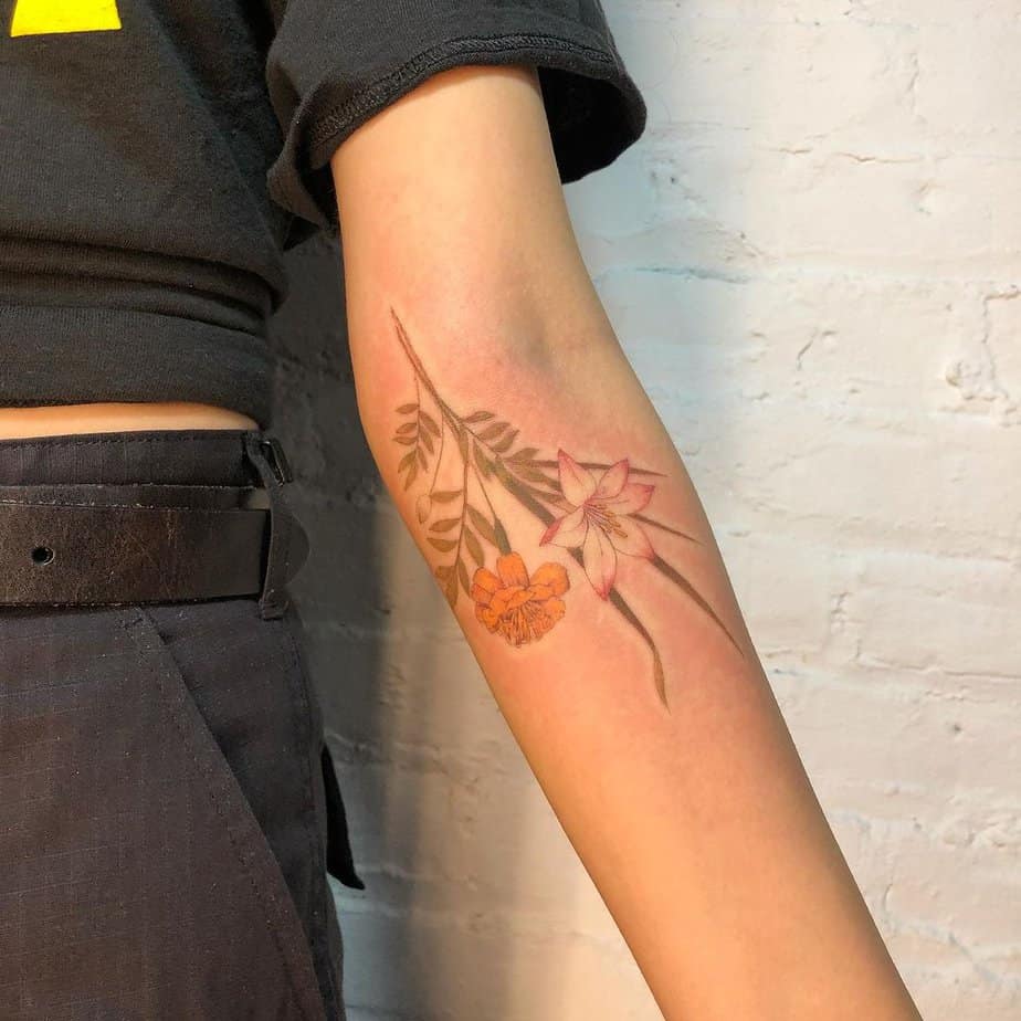 18 Charming Marigold Tattoos To Look Like A Ray Of Sunshine