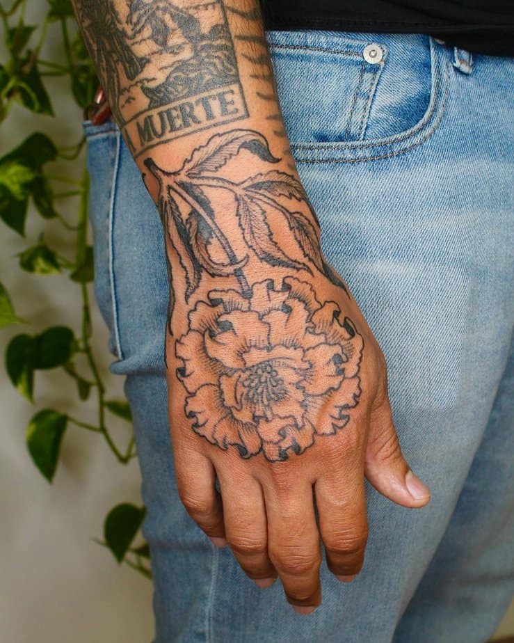 Marigold hand tattoo