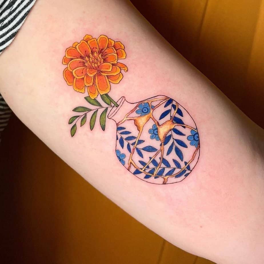 18 Charming Marigold Tattoos To Look Like A Ray Of Sunshine