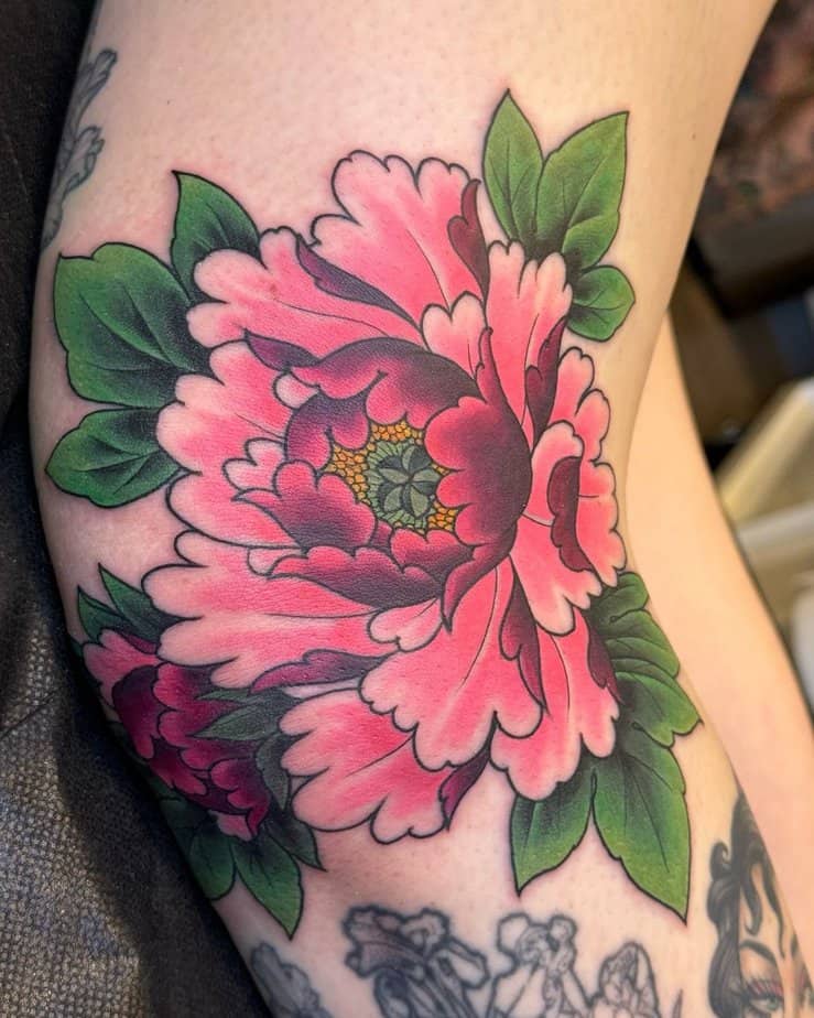 Pink peony on the knee