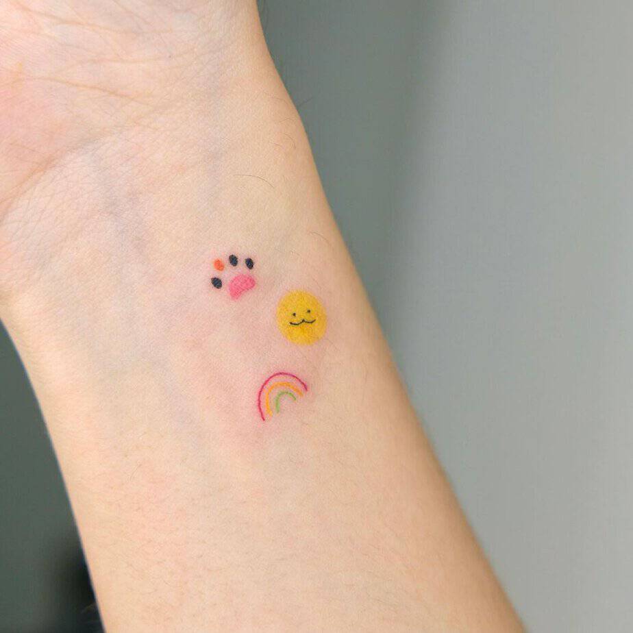 Tiny cat paw tattoo