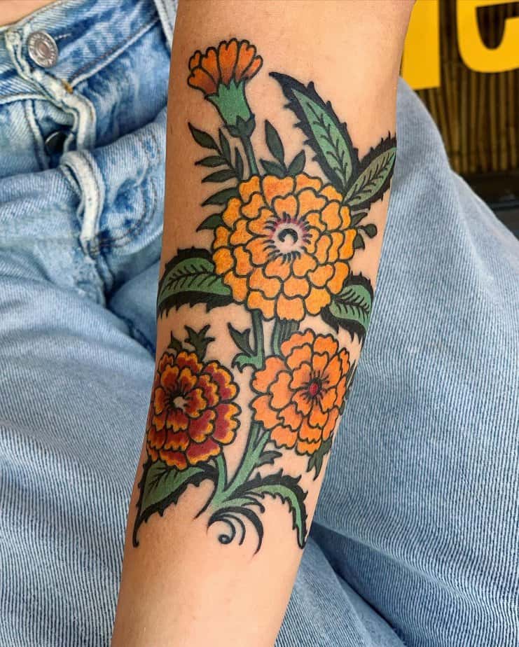 18 Charming Marigold Tattoos To Look Like A Ray Of Sunshine