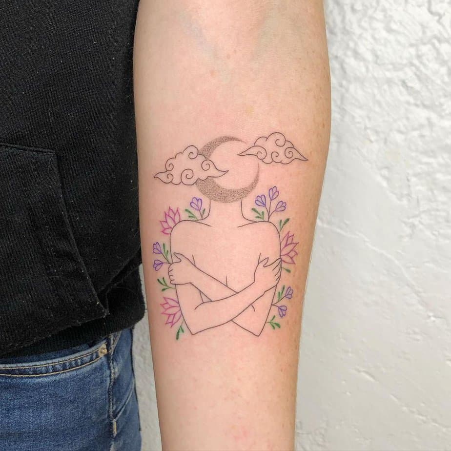 Self love tattoo with flowers clouds and the moon