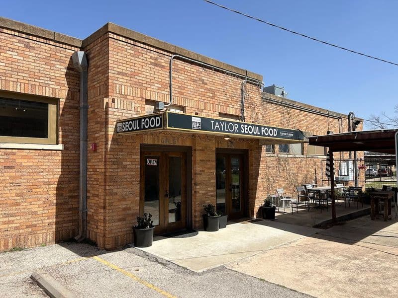 A Charming Texas Town Near Austin You’ll Want to Explore for BBQ, Antiques & Walkable Downtown Old Taylor High Brewing Taproom Stop