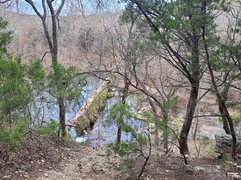 This Stunning 2.7-Mile Texas Hike Ends With Waterfalls And Wildflowers Navigation, Distance, and Elevation