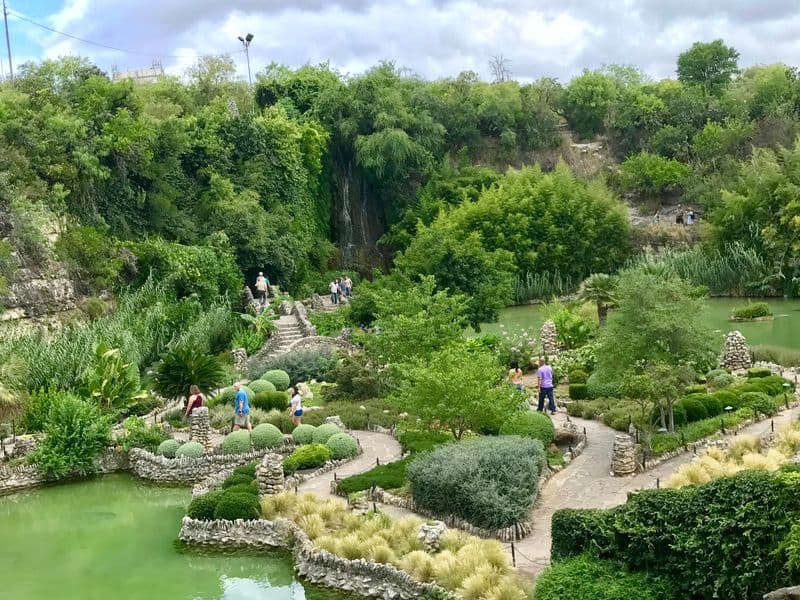 Koi Ponds And Curving Stone Bridges
