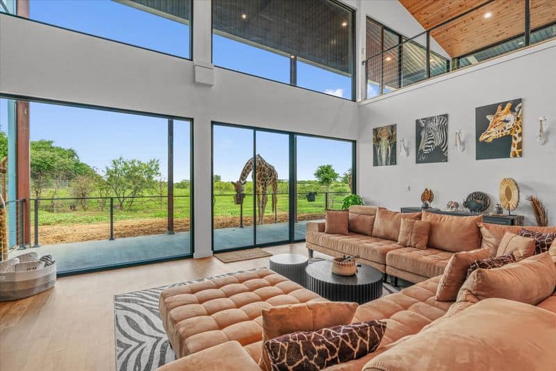 This Texas Wildlife Sanctuary Airbnb Lets You Glamp With Giraffes Swim And Play With Otters