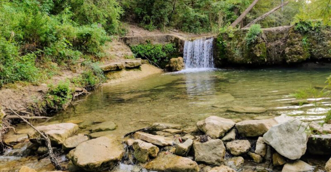 this stunning 27 mile texas hike ends with waterfalls and wildflowers
