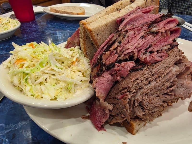 Every bite brings that perfect mix of corned beef rye Swiss and tangy sauerkraut