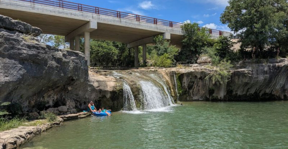 this beautiful texas waterfall is tucked inside a tiny town park