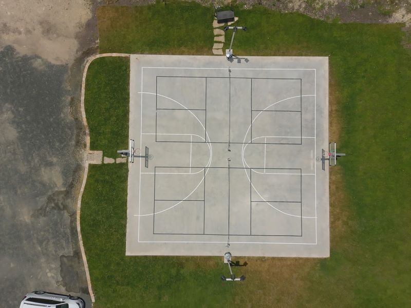 This Hidden Texas River Resort Is the Ultimate Weekend Escape Pickleball and Basketball by the Water