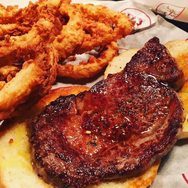 This Laid Back Texas Beach Spot Serves Incredible Food With a Gulf View Seared Salmon With Rosemary Grapes