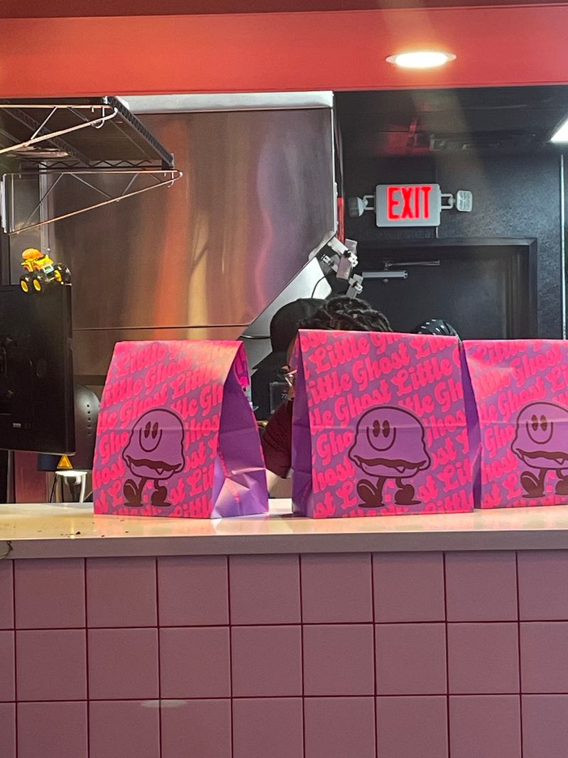 This Haunted-Looking Michigan Diner Serves Burgers And Fries Under A Ghostly Neon Glow Donuts That Change Every Month