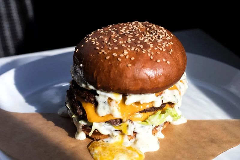 This Haunted-Looking Michigan Diner Serves Burgers And Fries Under A Ghostly Neon Glow Worth the Drive for Michigan Burger Lovers