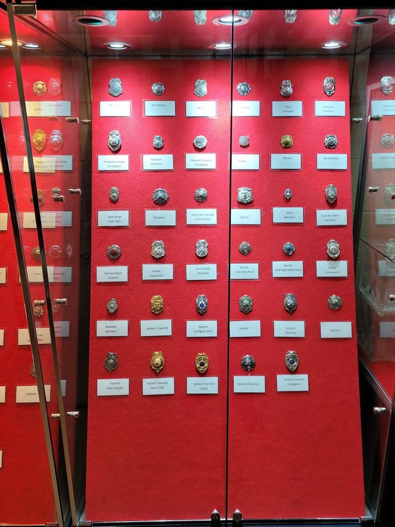 This Under-The-Radar Firefighting Museum In Michigan Is A Free Day Out Kids Talk About For Weeks A Wall of Extinguishers and Patches